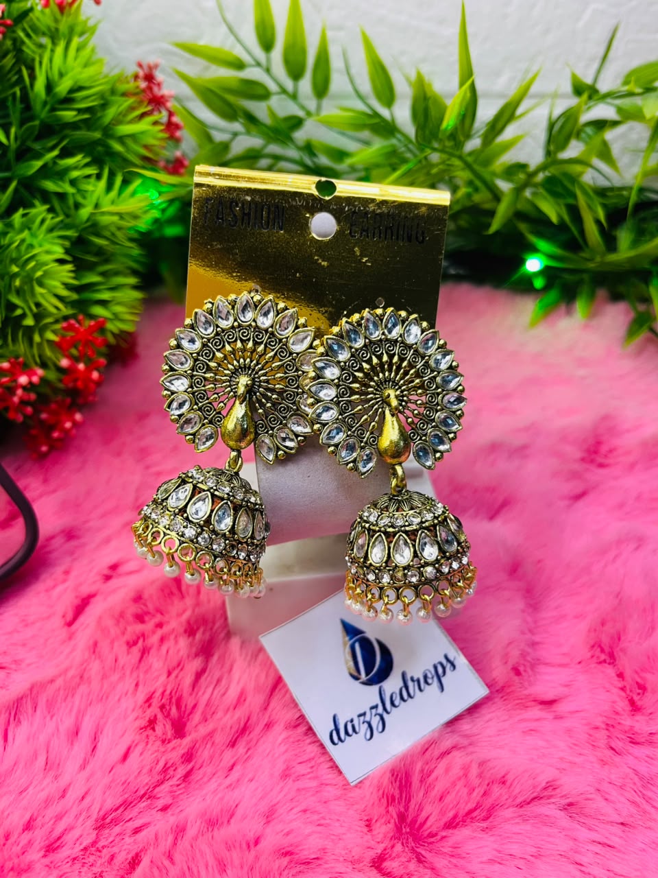 Royal peacock design antique gold stone studded jhumka earrings with traditional dangling details