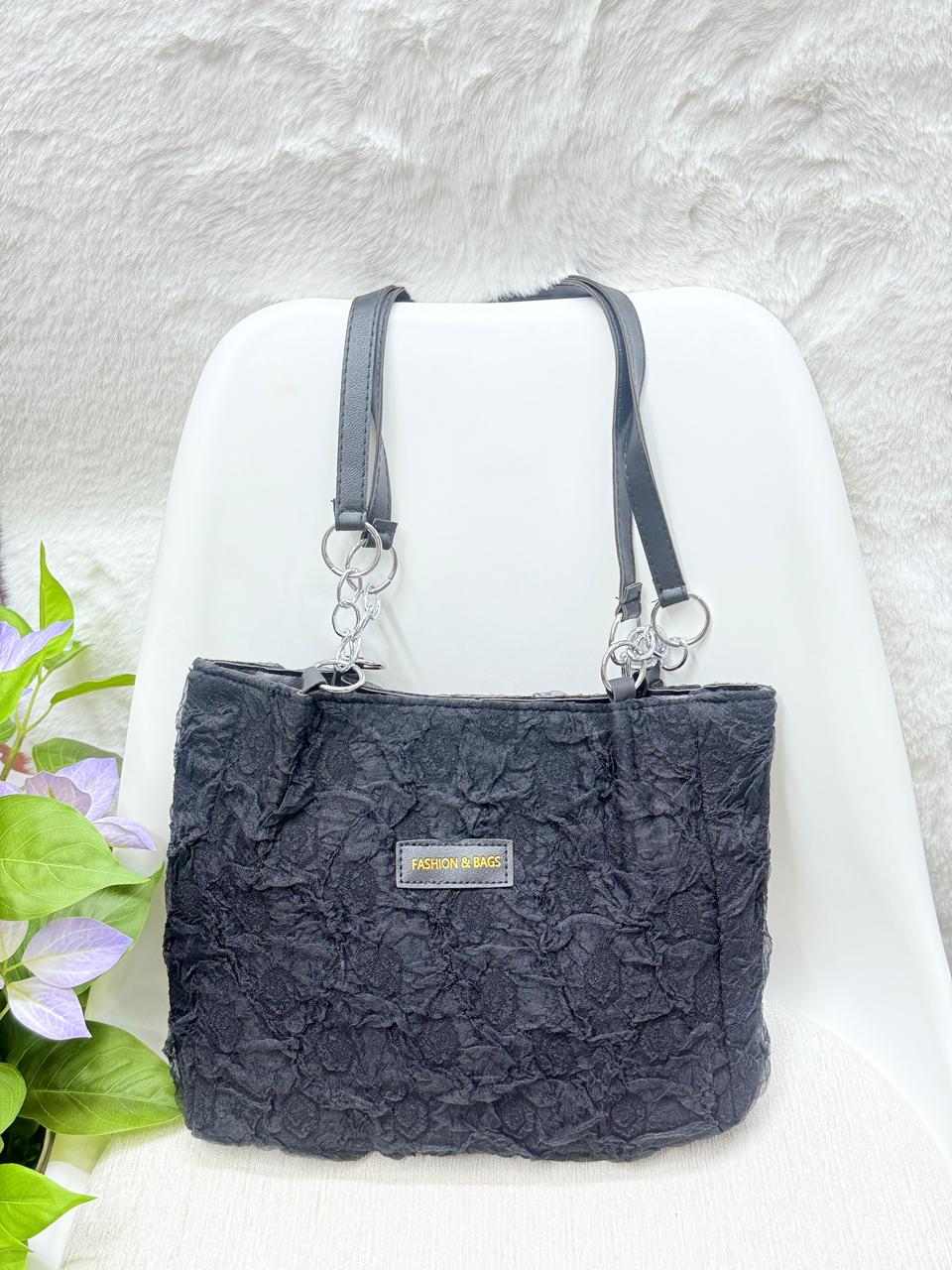 Woman wearing white sweatshirt carrying Korean black corduroy shoulder tote bag — view 2